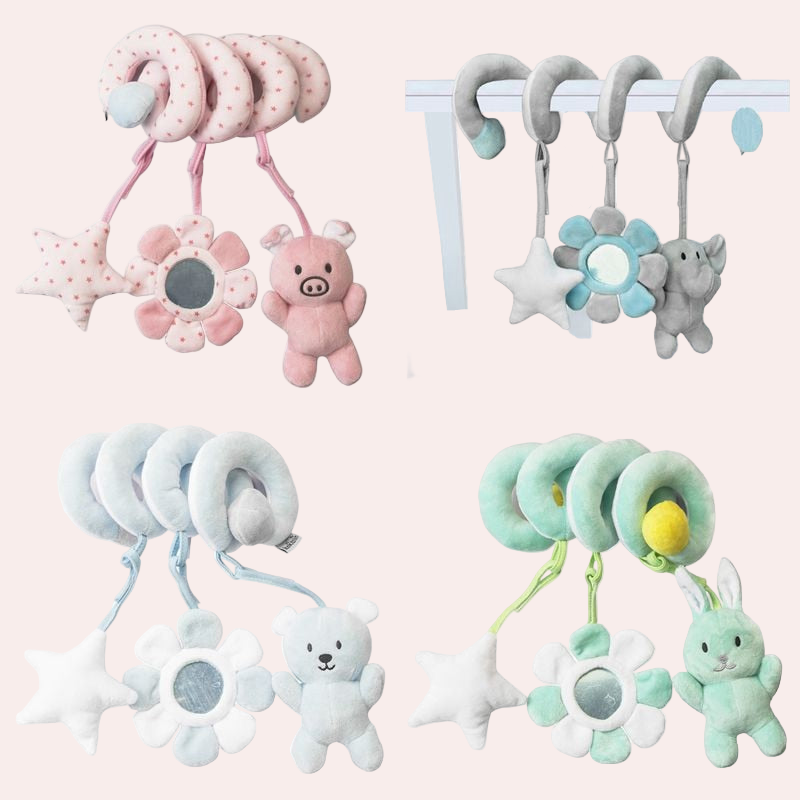 Collection of baby mobiles with soft toys and hanging elements on a white background
